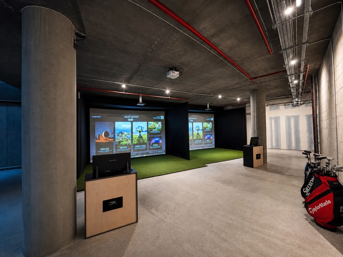 The Trackman simulator bays at SGC London Fields, with clubs ready to use